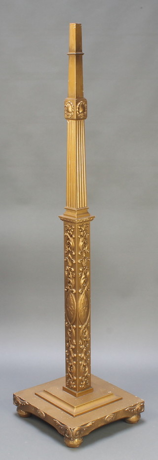 A square gilt painted fluted standard lamp raised on a stepped base 62 1/2"h x 15"w x 15"d 