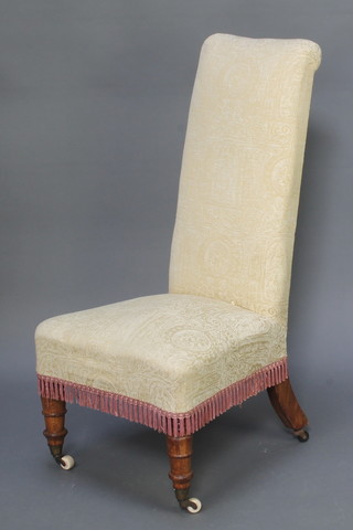 A Victorian Prie-Dieu chair upholstered in yellow material 