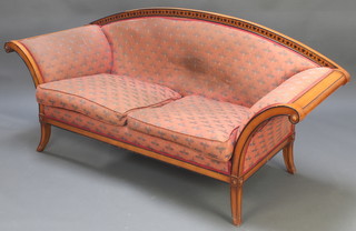 A Biedermeier style show frame sofa upholstered in orange material 31" x 76"l x 25"d raised on splayed supports  