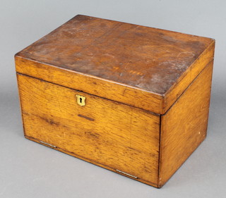 A Victorian light oak stationery box incorporating a writing slope fitted 1 inkwell with hinged lid 9 1/2" x 14 1/2" x 9 1/2" 