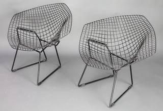 In the manner of Harry Bertoia, a pair of black painted diamond chairs  