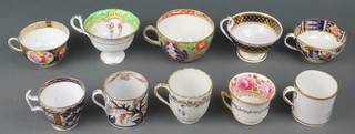 A Spode grey backed print coffee can, a New Hall Imari pattern ditto, a Derby Imari pattern tea cup, a Ridgway tea cup, a Derby Hamilton flute tea cup, a Wedgwood bute shaped tea cup, a Davenport ditto decorated with roses, a Ridgway tea cup decorated with a country house, an Imari pattern teacup and a New Hall ditto 