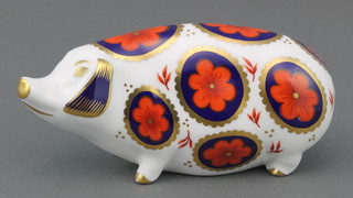 A Royal Crown Derby Imari pattern paperweight in the form of a pig with silver stopper 5", boxed