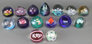 A collection of Caithness paperweights - Los Tres Amigos, Eternity, Whitefriars Triple Fancy, Luckenbooth, Abyss, Wild Card, Butterfly, Over Fear, Cauldron, Moon Flower, Shock Wave, Debutante and Millennium and 2 others 