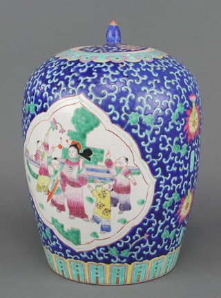A Chinese famille rose baluster vase and cover, the blue scale ground decorated with panels of figures 12" 