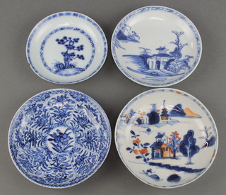 An 18th Century Nanking Cargo blue and white dish decorated with a pavilion 4 1/2", with Christies label, a ditto decorated with a tree 4", an 18th Century Chinese blue and white saucer decorated with a tree 4", an 18th Century Chinese blue and white saucer decorated with flowers 5" and an 18th Century Chinese dish decorated with buildings 5" 