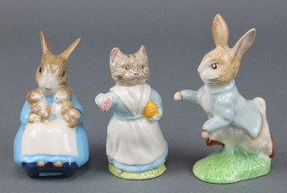 A Beswick Beatrix Potter figure - Peter Rabbit 4 1/2", 2 Royal Albert ditto Mrs Rabbit and Bunnies 4" and Tabitha Twitchett 3 1/2" 