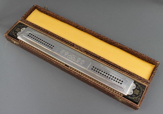 A large harmonica 'The Marine Band Echo', by M Hohner, cased 15 3/4"