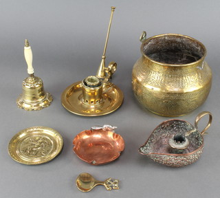 An Indian pierced copper and brass boat shaped chamber stick, a circular brass bowl decorated figures 6", a Victorian brass candlestick, a table bell etc 