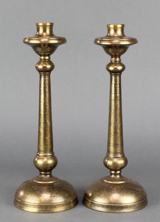 A pair of Benares brass candlesticks 11" 
