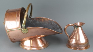 A copper helmet shaped coal scuttle with brass swing handle together with a copper harvest measure 8" 