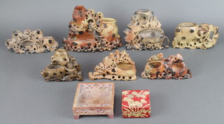 Seven various carved soap stone brush pots, a square carved soap stone box and cover 1 1/2" x 3" x 3" together with a square pierced soap stone stand (af) 2" x 4 1/2" x 4 1/2"  