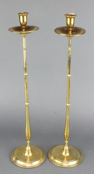 A pair of Victorian brass candlesticks with wide sconces 22" 