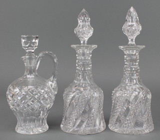 A pair of Edwardian cut glass spiral decanters and stoppers 11", a ditto ewer 9" 