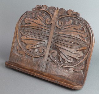 An oval carved oak "Misery" stool 6"h x 15"w x 12"d 