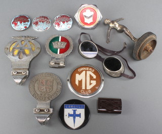 A Desmo Art Deco car mascot in the form of a standing girl 5", a Merchant Navy enamelled radiator badge, a Wolverhampton Motor-Cycle and Car Club radiator badge, an AA beehive badge, an MG owners badge, 3 Triumph car badges, a Crossel badge, pair of goggles and a Bakelite snuff box 