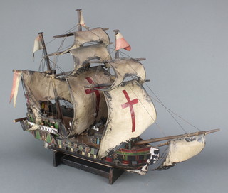 A wooden model of a 3 masted galleon 22"h x 26"l x 7"w 