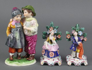 A pair of Samson figures of a lady and gentleman standing before Bocage 4", a Continental group of 2 children 6" 