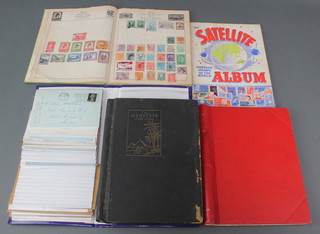 A Baron red album of used world stamps - Germany, Egypt, Spain, Australia, a green Capital album  of used world stamps - Turkey, Spain, South Africa, Russia, a Wanderer black album of used world stamps, a Satellite album of world stamps and an album of stamped envelopes
