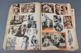 A scrapbook with various Shirley Temple related clippings