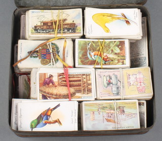 A tin of cigarette cards 
