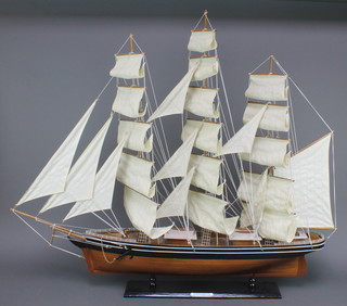 A wooden model of The Cutty Sark 34"h x 39"l x 4"w 