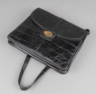 A lady's 1980's crocodile black shoulder handbag 8" x 10" x 3" 
