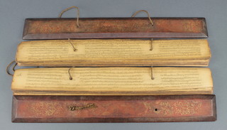 An Indian manuscript on papaya/leaf? in a lacquered case 3" x 17" x 2 1/2" 