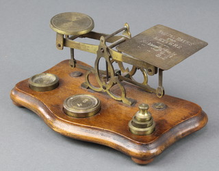 A pair of brass and mahogany letter scales and weights