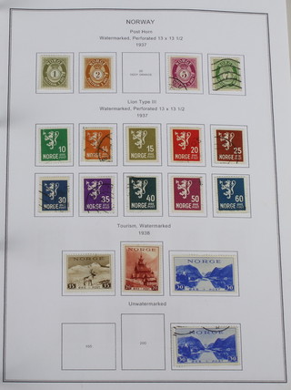 An album of mint and used stamps Finland, Norway, Spain, Switzerland 1937-1952