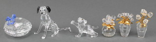A Swarovski glass figure of a seated hound, a ditto of a lion cub 2", 3 floral groups and a heart shaped box 