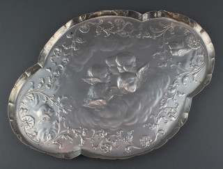 An Edwardian repousse silver quatrefoil dressing table tray decorated with Reynolds angels enclosed by scrolls London 1902 320 grams 12" 