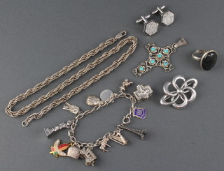 A silver charm bracelet, pendant, brooch, ring, pair of cufflinks and necklace 108 grams