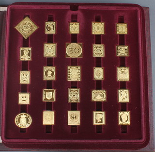 A Franklin Mint 24ct gold plated on sterling silver proof set - The Worlds First Stamps, 73 in a fitted folder with paper work 20.6 ozs