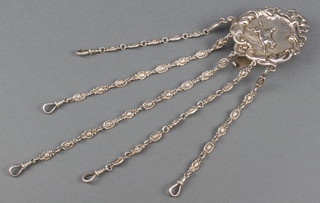 A Victorian silver chatelaine depicting a lady riding a horse with 6 floral drops and clasps London 1897, maker George Heath, 134 grams 