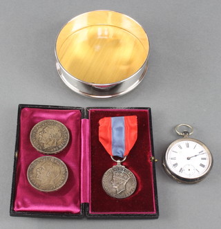 A silver coaster London 2000, together with 2 crowns, an Imperial Service Medal , a silver cased pocket watch and 2 keys  