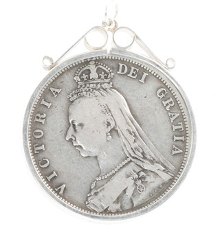 A Victorian half crown 1887 in a silver pendant mount 