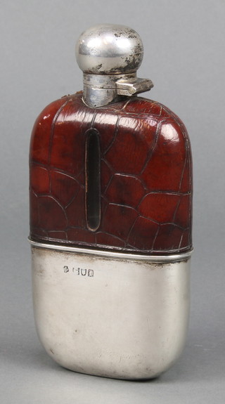 A leather bound hip flask with silver cup base London 1901 and lid Sheffield 1915 William Hutton and Sons Ltd
