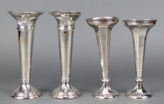 A pair of  silver tapered spill vases Birmingham 1911 7",  another pair London 1917 7 1/2" 