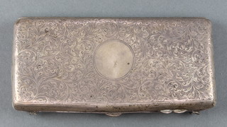 An Edwardian silver cigarette case with chased scroll decoration Birmingham 1906 114 grams