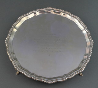 A silver salver with gadrooned rim and presentation inscription on pad feet Chester 1922 542 grams 10" 
