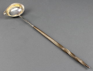 A Georgian silver toddy ladle with whalebone handle, rubbed marks 14 1/2" 