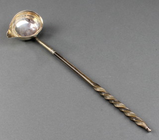 A Georgian silver toddy ladle with whalebone handle, rubbed hallmarks 12" 