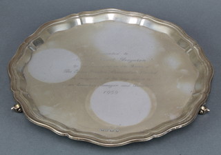 A silver salver with Chippendale rim and presentation inscription Sheffield 1957 830 grams 12" 