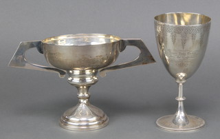 A Victorian chased silver goblet London 1856 7" and a 2 handled presentation trophy Birmingham 1921 6" 450 grams 