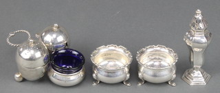 A Victorian silver condiment set of ovoid form and rope twist handle Sheffield 1898, 2 salts and a pepperette 198 grams 