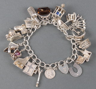 A silver charm bracelet 80 grams