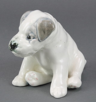 A Russian porcelain figure of a seated puppy 5"