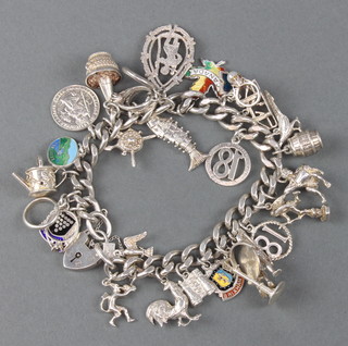 A silver charm bracelet 89 grams 