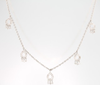 An 18ct white gold diamond set heart necklace 6.5 grams 